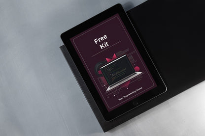 Tablet displaying a 'Free Kit' offer on a gray surface