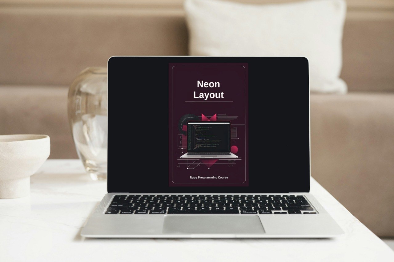 Laptop on a table with a neon layout design on the screen
